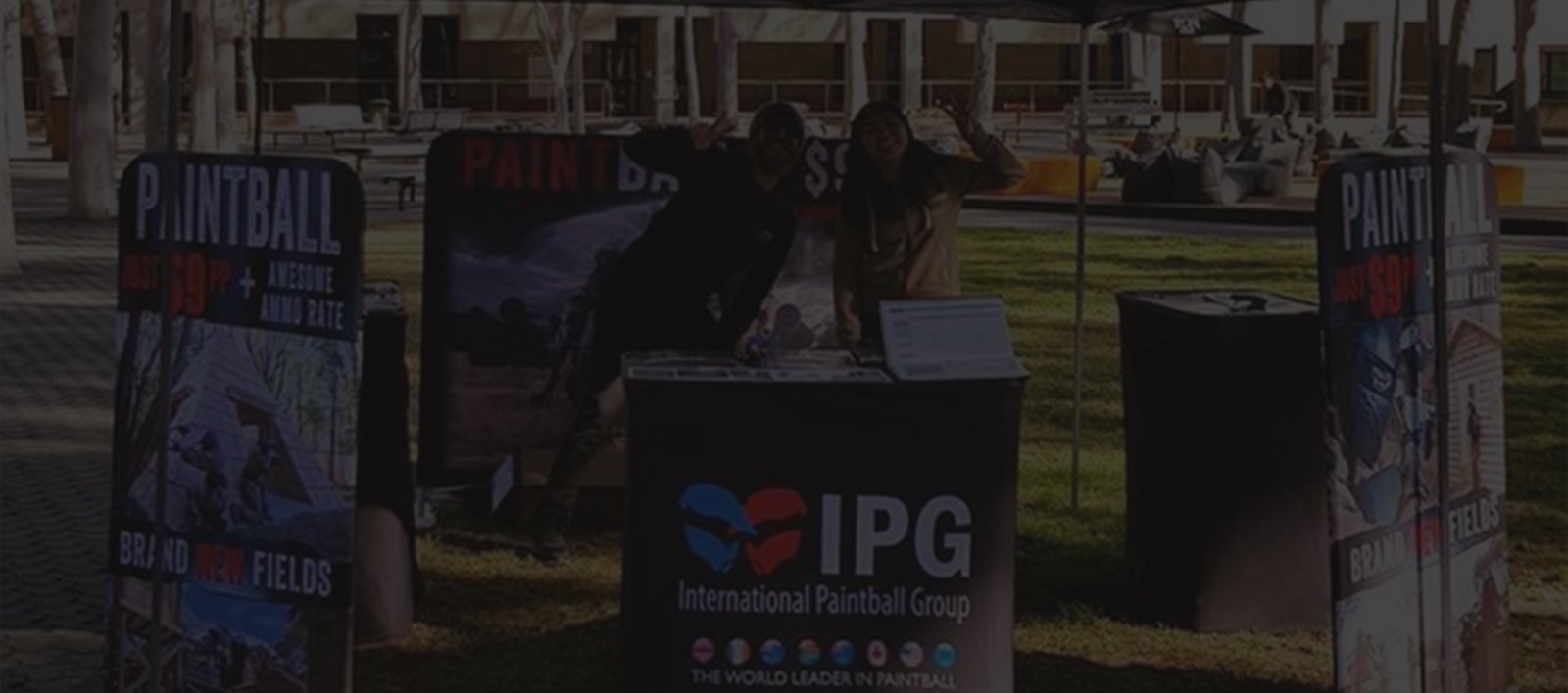 On Point Paintball promotional team at a sales stand